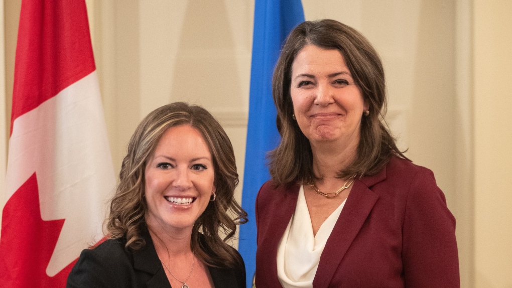 Alberta Premier Danielle Smith and Minister of Environment and Protected Areas Rebecca Schulz stand together during the swearing in of her cabinet, in Edmonton, Friday, June 9, 2023. THE CANADIAN PRESS/Jason Franson.